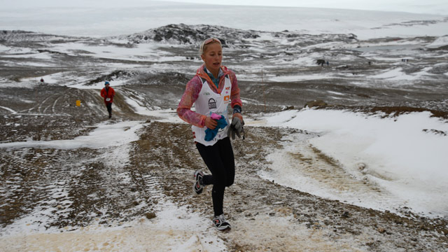 PHOTO: Winter Vinecki running along the Antarctica Marathon course on King George Island. Icy conditions made this one of the toughest marathons many runners have encountered.