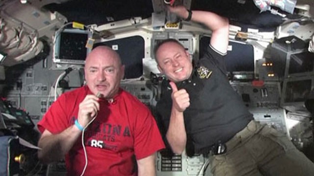 PHOTO:Â Commander Mark Kelly, left, and Mission Specialist Mike Fincke aboard space shuttle Endeavour talk to students at Mesa Verde Elementary School