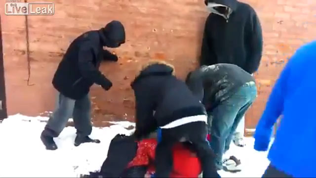 PHOTO: In a clip posted on YouTube, six attackers are seen brutally beating and robbing a teenager in an alley in Chicago, IL.