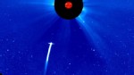 PHOTO: Comet Lovejoy plunging toward the sun, as seen by NASA's SOHO spacecraft. The image is in false color. The sun is blocked by a disc so that its light will not drown out everything around it.