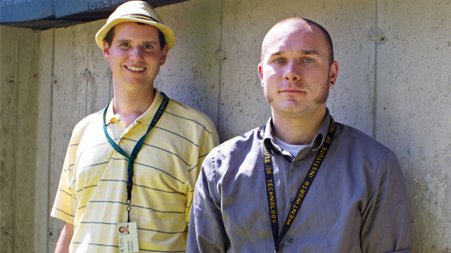 PHOTO: Lincoln Laboratory researchers Gregory Charvat, background, and John Peabody, foreground, stand before the solid concrete wall through which they successfully detected and captured human movement.
