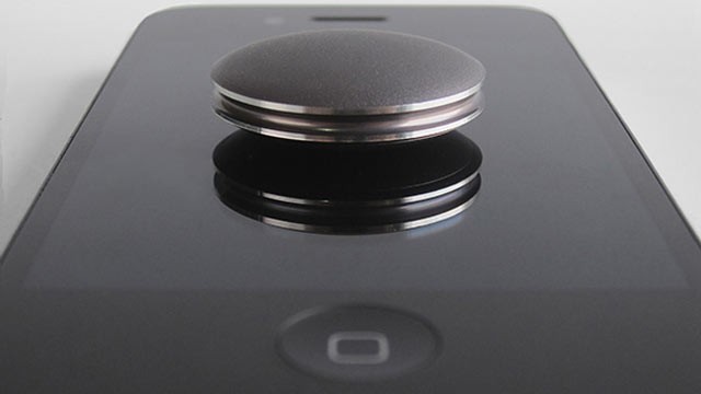 PHOTO: With the Misfit Shine you can tap it to an iPhone to pair it.