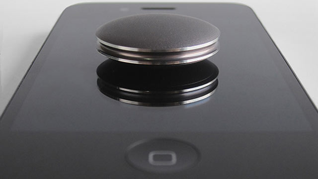 PHOTO: With the Misfit Shine you can tap it to an iPhone to pair it.