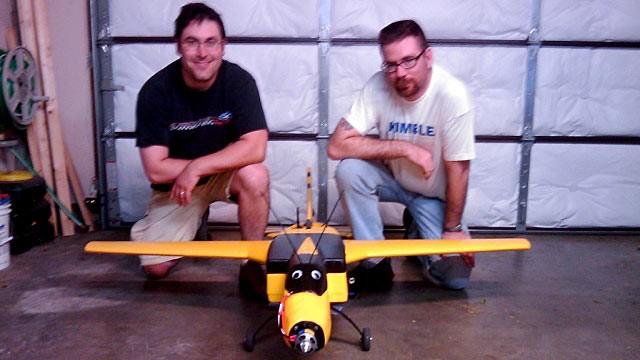 PHOTO: Seen here is Richard Perkins and Mike Tassey with an early Wireless Aerial Surveillance Platform, aka WASP drone airplane model.