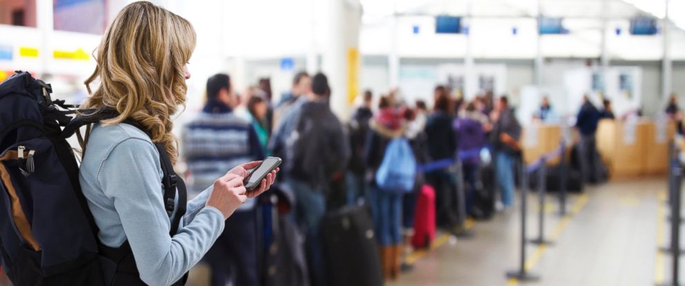 PHOTO: A woman waits in line at an airport in an undated stock photo.