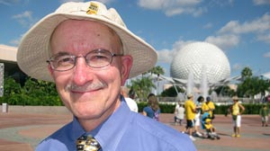 Photo: Steven Barrett, author of Hidden Mickeys, A Field Guide to Walt Disney Worldâ??s Best Kept Secrets, searches for hidden Mickey Mouse designs throughout Walt Disney World