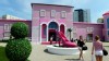 Visitors stand in front of the Barbie Dreamhouse Experience near Alexanderplatz square in Berlin, May 16, 2013. The 2,500 square meter Barbie Dreamhouse Experience will be open for three months in Berlin.