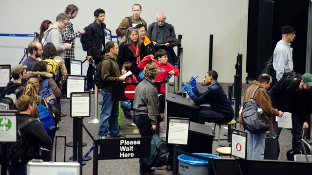 PHOTO: Travelers wait in line to go through security in the departure hall at San Francisco International Airport in San Francisco, Calif., Nov. 23, 2011.