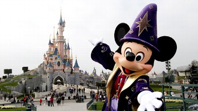 PHOTO: Disney character Mickey poses in front of the Sleeping Beauty Castle at Disneyland, March 31, 2012.