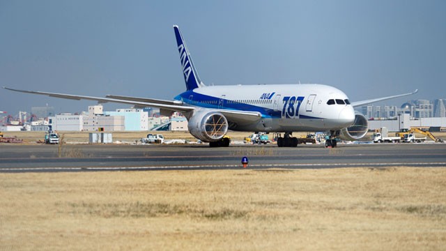 PHOTO: A Boeing Co. 787 Dreamliner aircraft operated by All Nippon Airways Co. (ANA) stands with its engines covered at Haneda Airport in Tokyo, Japan, Jan. 30, 2013.