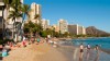 PHOTO: Tourists walk Waikiki Beach with Diamond Head in Honolulu, Oahu, Hawaii.