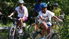 PHOTO: Sasha Obama and first lady Michelle Obama bike while vacationing on Martha's Vineyard, August 23, 2011, in West Tisbury, Mass.