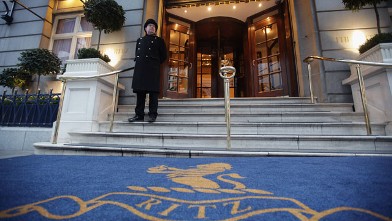 PHOTO: A doorman stands at the entrance to The Ritz Hotel on February 21, 2011 in London, England.