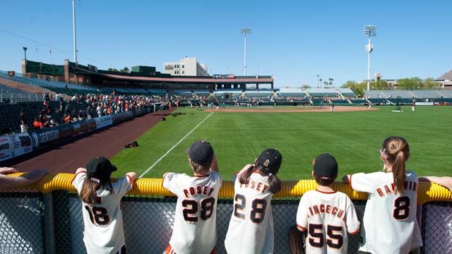 PHOTO: A general view of young baseball fans behind the outfield wall before a spring training game during batting practice at Scottsdale Stadium on March 3,2012 in Scottsdale, Ariz.