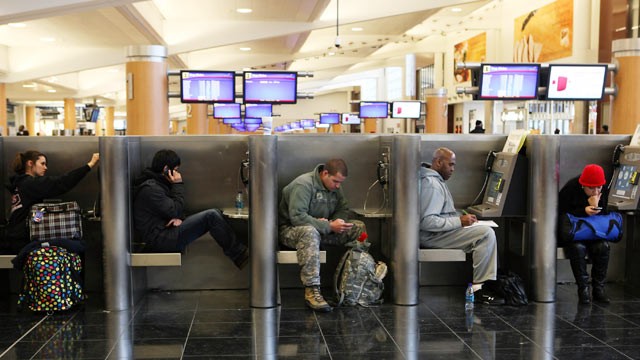 PHOTO: Delayed and stranded passengers waiting for flight information fill cubicles throughout Atlanta Hartsfield-Jackson International Airport after a snow storm, Jan. 10, 2011 in Atlanta, Georgia.