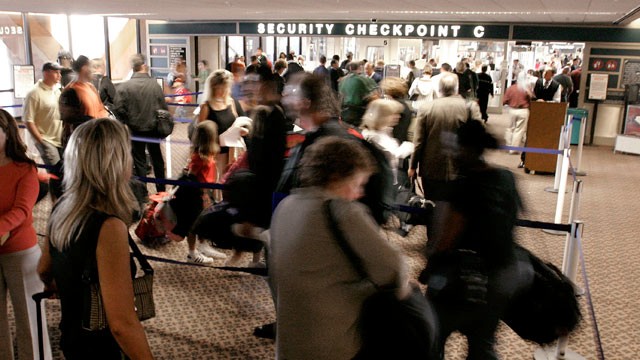 PHOTO: Airline passengers wait in line at a security checkpoint in terminal four at Phoenix Sky Harbor International Airport in this December 10, 2004 file photo from Phoenix, Arizona.