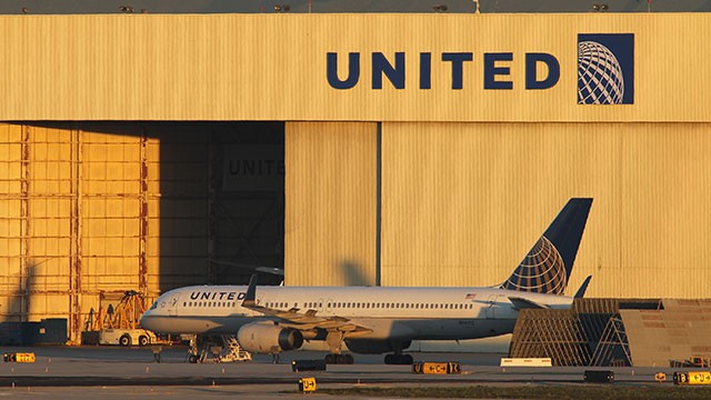 PHOTO: With its Boeing 787 Dreamliner jets grounded, a Boeing 777 jet is parked near a United Airlines hanger before a new day of service as United Airlines carries on with its fleet of 777s at Los Angeles International Airport (LAX) on January 17, 2013 i