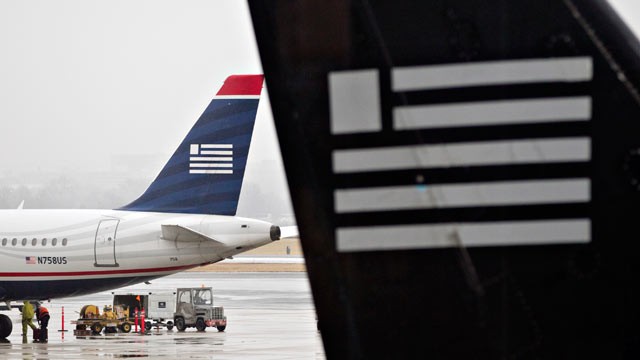 PHOTO: US Airways planes sit on the tarmac at Ronald Reagan National Airport in Washington, D.C., Jan. 23, 2012.