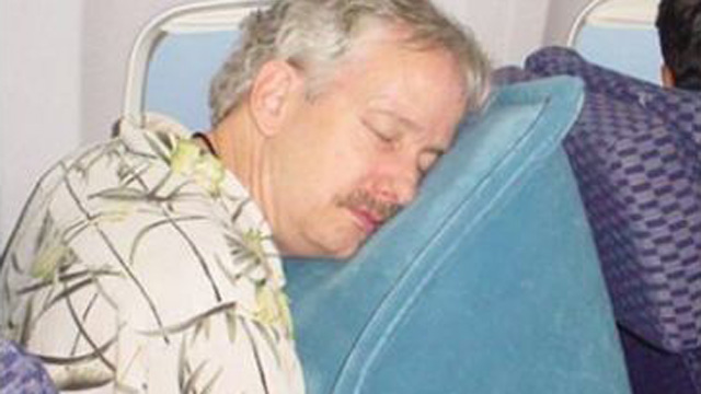 PHOTO: SkyRest Pillow, a large, inflatable cushion you place on your open seat tray table and slump over.