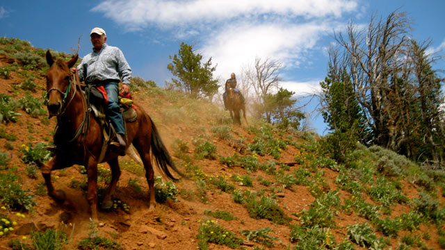 PHOTO: Nick Battiste, (in foreground) and Nikki Battiste in background during a dude ranch ride.