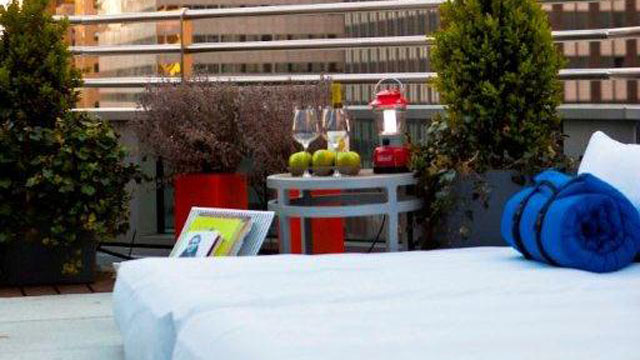 PHOTO: Beds, snacks and wine service are set up on room terraces as part of Hyatt 48 Lex's "Suite Glamping" program.