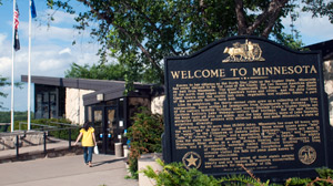PHOTO A tourism sign welcoming peole to Minnesota is shown.