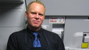 PHOTO A frustrated JetBlue flight attendant allegedly fled his plane via emergency shoot ? beer in hand ? after getting into a fight with a passenger and then cursing out the entire cabin over the loudspeaker.