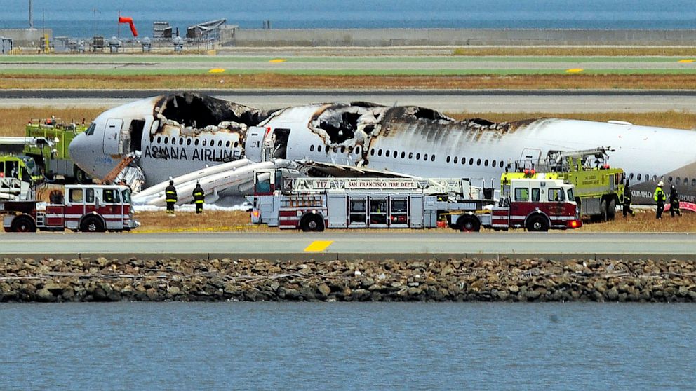 An Asiana Airlines Boeing 777 is seen on the runway at San Francisco International Airport after crash landing, July 6, 2013.