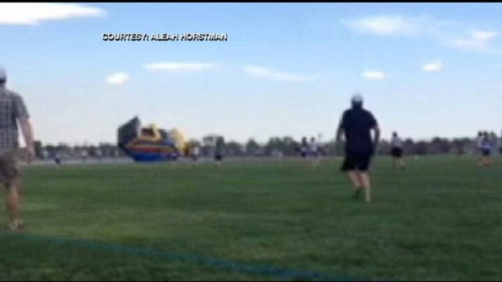 PHOTO: Bounce house goes airborne with two children inside.