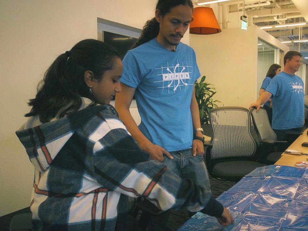 PHOTO: Hari Bhimaraju goes over blueprints at the San Francisco based tech company Piper.