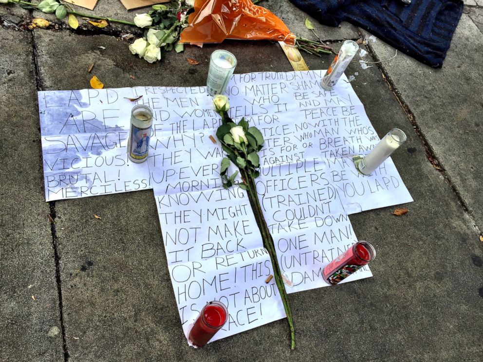 PHOTO: Flowers and signs were seen on Monday March 2 near the site of the shooting of a man on Los Angeles Skid Row.