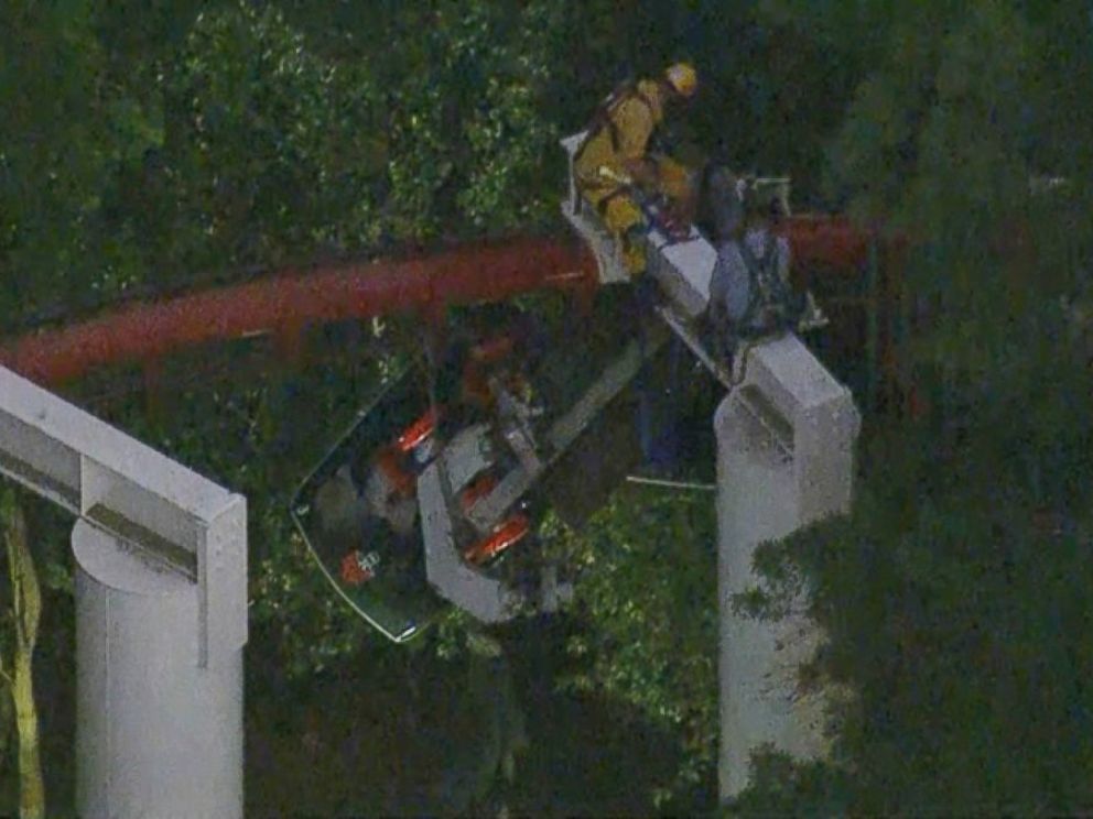 PHOTO: Firefighters and park maintenance workers in harnesses removed the stranded riders one by one.