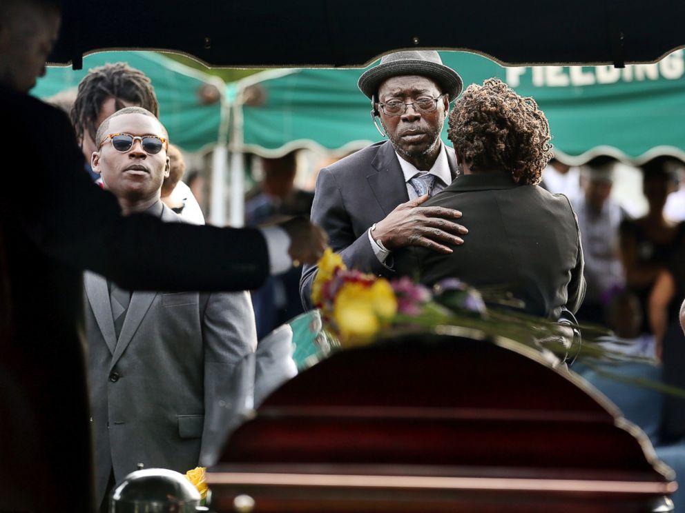 PHOTO: Parents of Tywanza Sanders, Tyrone Sanders and Felicia Sanders comfort each other at the graveside of their son at Emanuel AME Cemetery in Charleston, South Carolina, in this June 27, 2015 file photo.