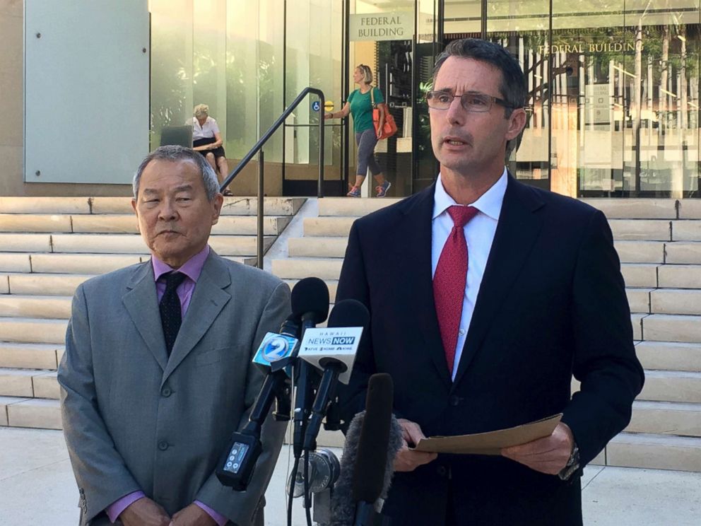 PHOTO: Paul Delacourt, the FBI special agent in charge of the Hawaii bureau, right, speaks at a news conference as Acting United States Attorney Elliot Enoki, left, listens outside federal court in Honolulu, July 10, 2017.