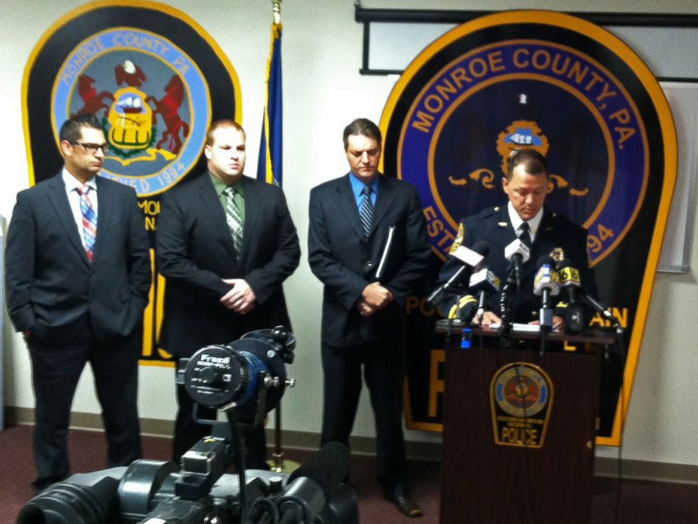 PHOTO: Pocono Mountain Regional Police Chief Christopher Wagner, with fellow law enforcement officers, as he speaks during a Sept. 15, 2015, news conference about plans to arrest 37 people in the December 2013 death of 19-year-old Chun Michael Deng.