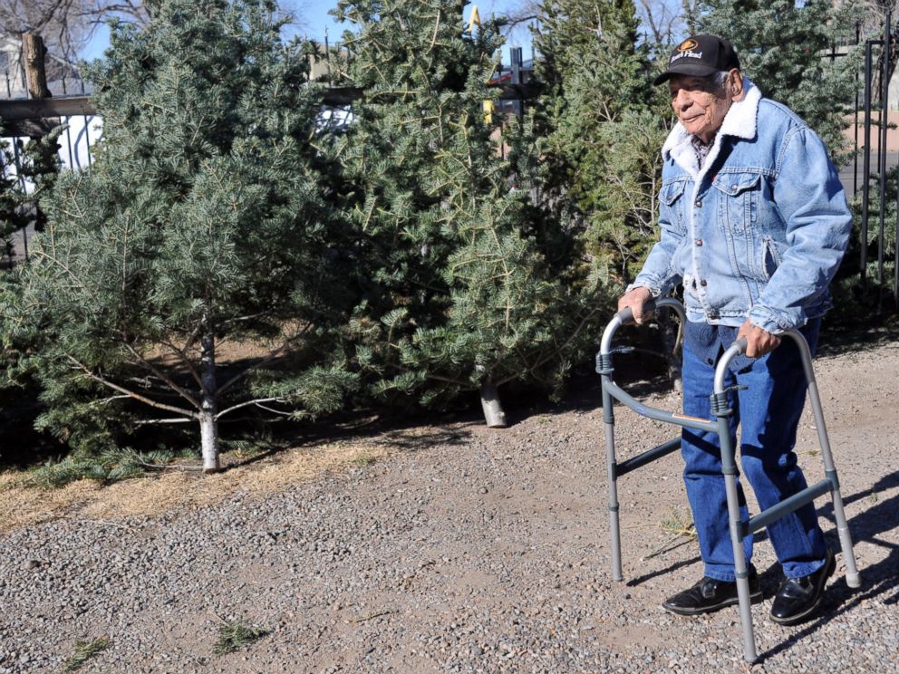 PHOTO: In this Dec. 9, 2011 file photo, Tony Garcia, 99, sells Christmas trees from his front yard on 4th Street, north of Paseo del Norte in Albuquerque, N.M.