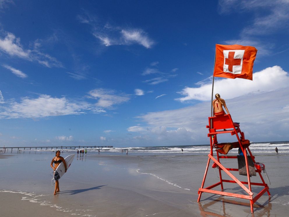 PHOTO: Elise Byrd with the American Red Cross Volunteer Life Saving Corps watches to make sure people venturing into the surf off of Jacksonville Beach, Fla. stayed safe, July 2, 2014.