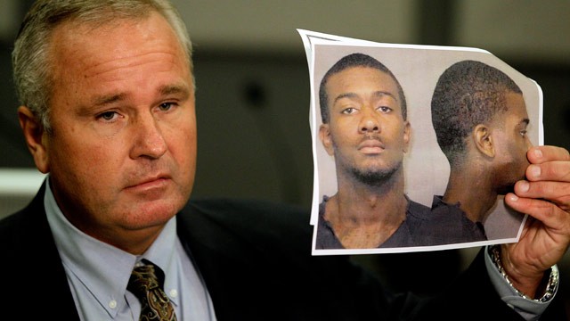 PHOTO: Auburn Police Chief Tommy Dawson holds up a photo of Desmonte Leonard, 22, of Montgomery, Ala., the suspect wanted for fatally shooting three people, including two former Auburn University football players, and wounding another three people during 