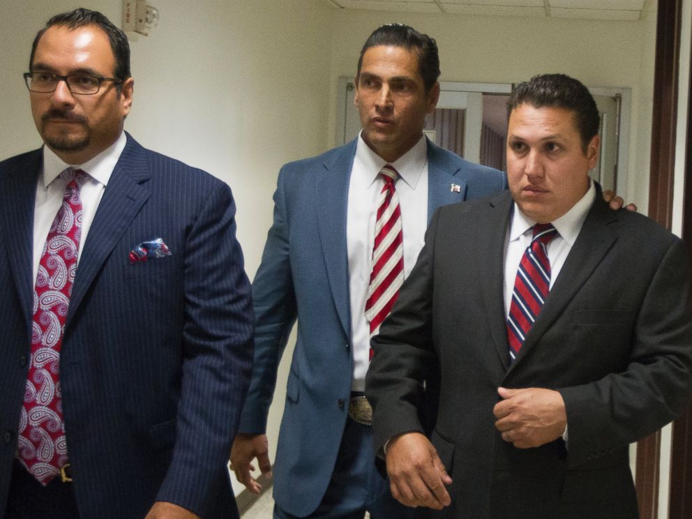 PHOTO: David Barajas, right, walks through the hallway with his attorneys Sam Cammack, center, and Phil Morin as the jury deliberates at the Brazoria County Courthouse on Aug. 27, 2014, Angleton, Texas.