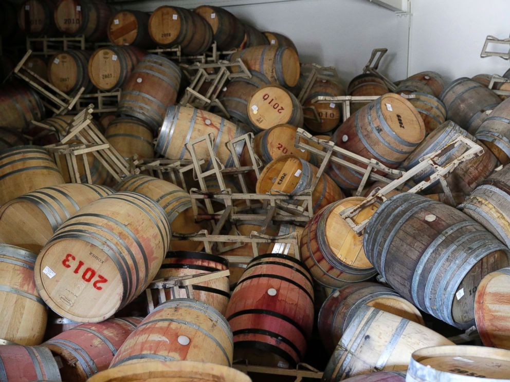 PHOTO: Barrels filled with Cabernet Sauvignon are toppled on one another following an earthquake at the B.R. Cohn Winery barrel storage facility, Aug. 24, 2014, in Napa, Calif.