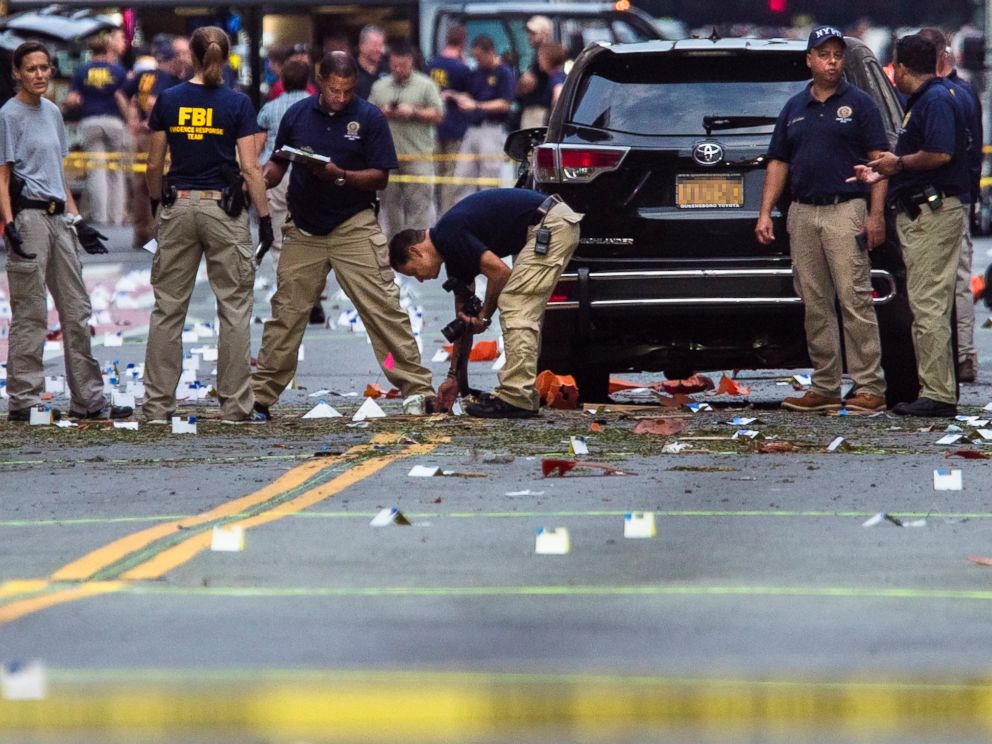 PHOTO: Members of the Federal Bureau of Investigation carry on investigations at the scene of Saturdays explosion on West 23rd Street and Sixth Avenue in Manhattans Chelsea neighborhood, New York, Sept. 18, 2016.
