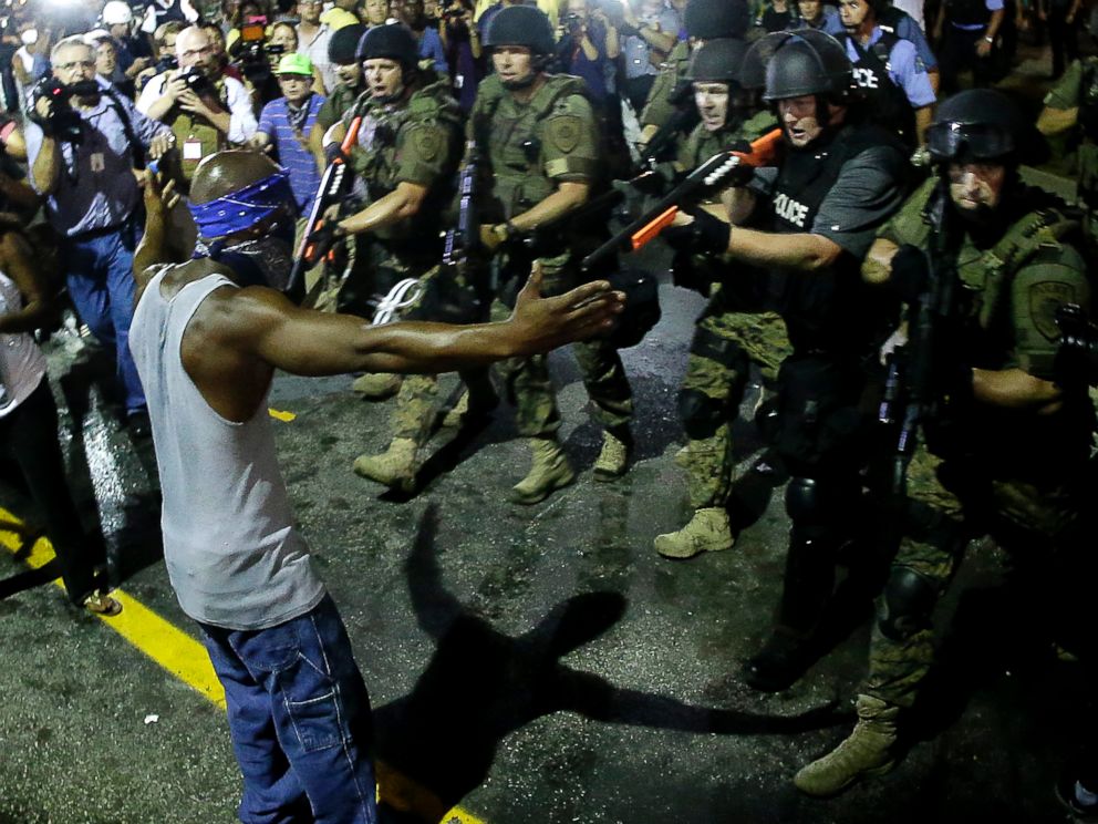 PHOTO: Police arrest a man as they disperse a protest in Ferguson, Mo., Aug. 20, 2014.