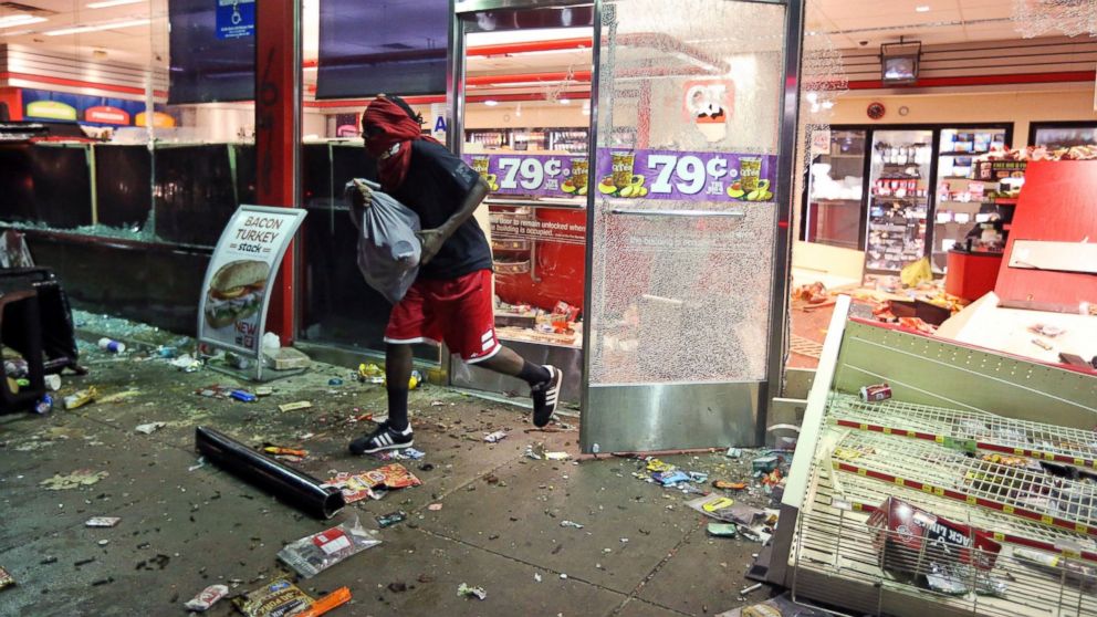 PHOTO: A man leaves a QuikTrip store in Ferguson, Mo., Aug. 10, 2014. The store was overrun by looters during protests for Michael Brown, 18, who was shot to death by police.
