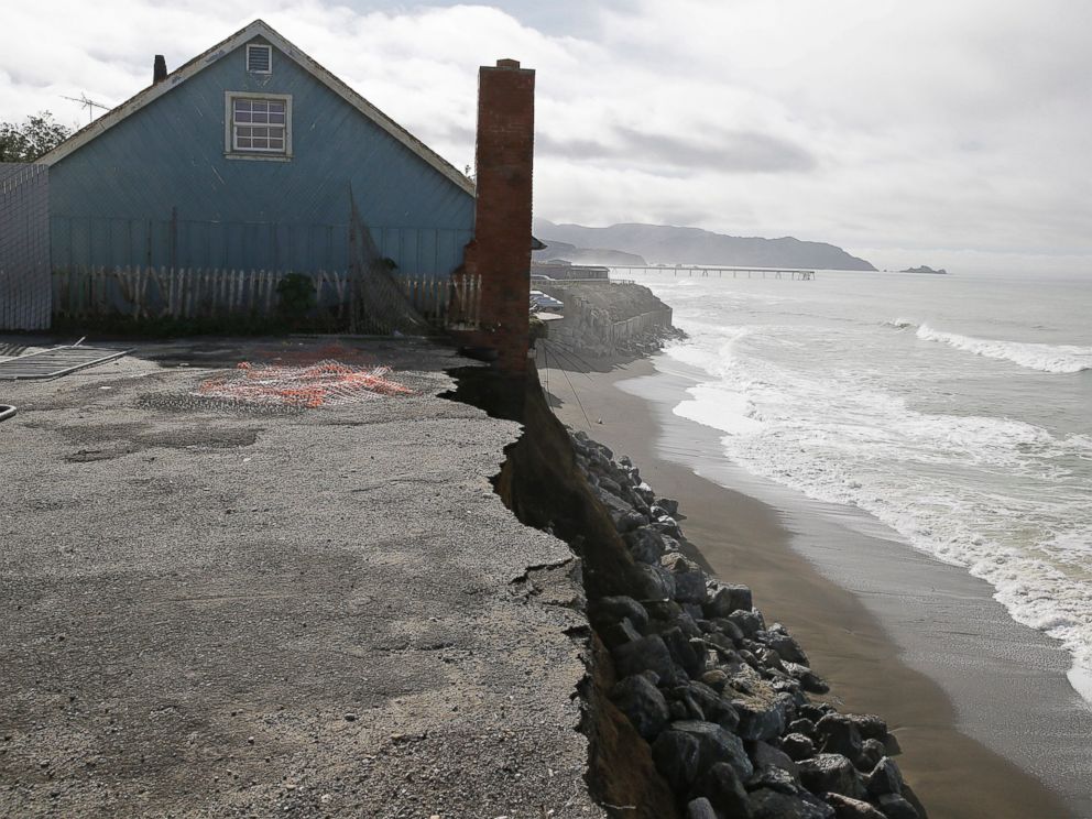PHOTO: A house stands on the edge of an eroding cliff with the Pacifica Pier in the background Jan. 25, 2016, in Pacifica, Calif.