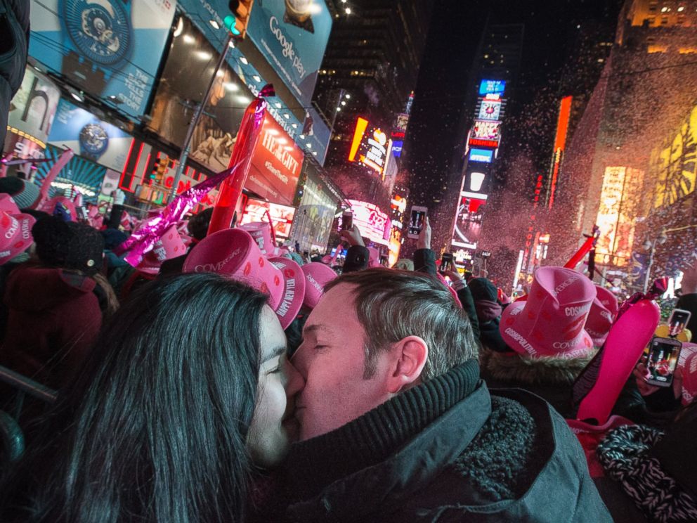 Chris and Chelsea Crawford, of Scotland, share a kiss at midnight in Times Square during a New Years Eve celebration, Thursday, Jan. 1, 2015, in New York. Thousands braved the cold to watch the annual ball drop and ring in the new year.