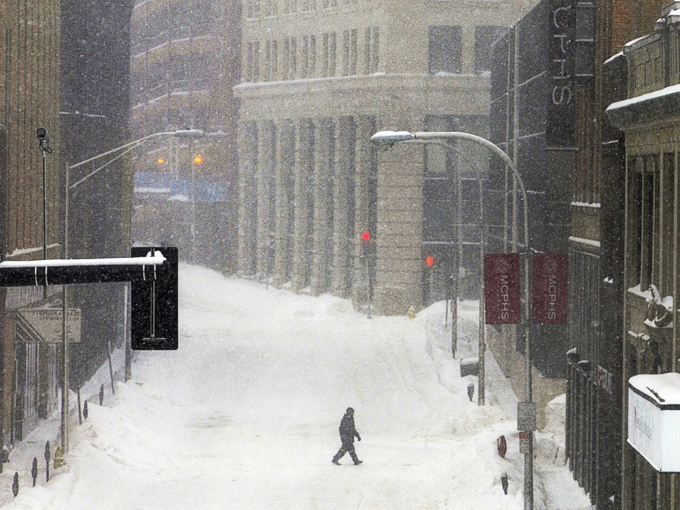 PHOTO: A single pedestrian crosses Mechanic Street during a snowstorm, Feb. 2, 2015, in downtown Worcester, Mass.