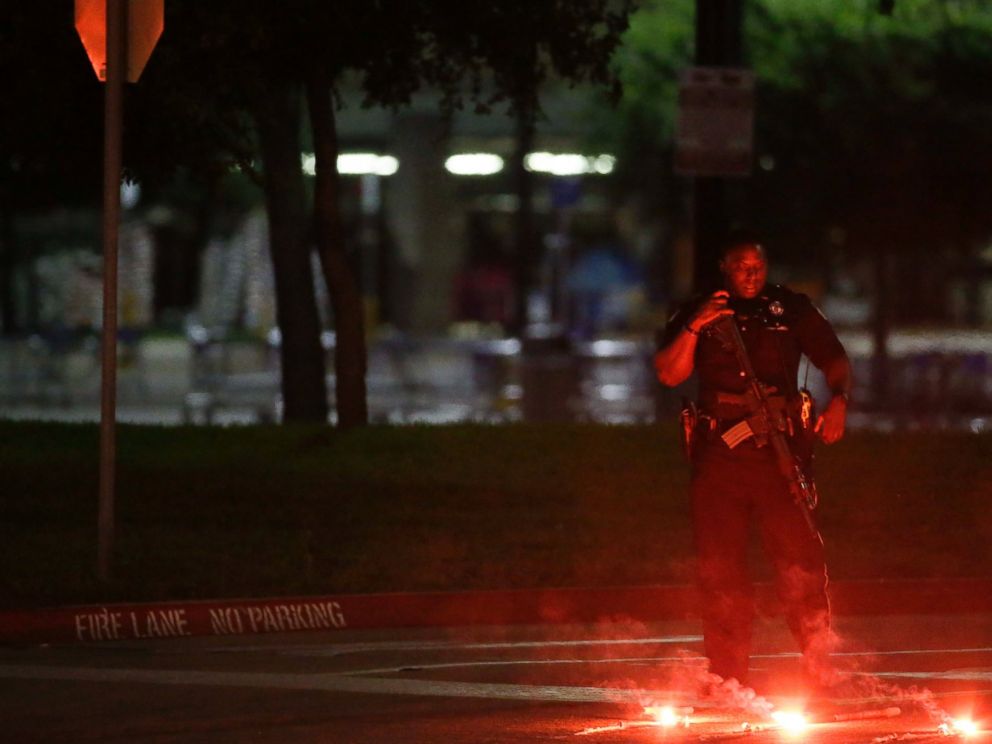 PHOTO: An armed police officer stands guard at a parking lot near the Curtis Culwell Center, May 3, 2015, in Garland, Texas.