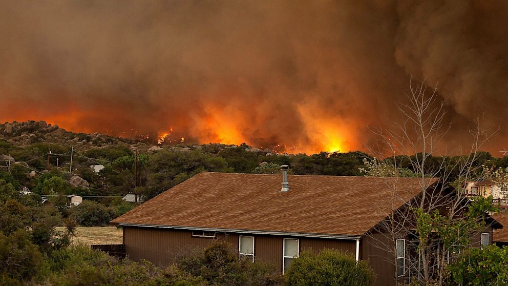 The Yarnell Hill Fire burns through the town of Yarnell, Ariz. on Sunday, June 30, 2013.