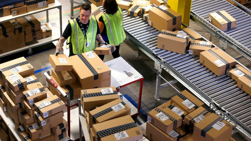 PHOTO: Amazon.com employees organize outbound packages at an Amazon.com Fulfillment Center, Dec. 2, 2013, in Phoenix.