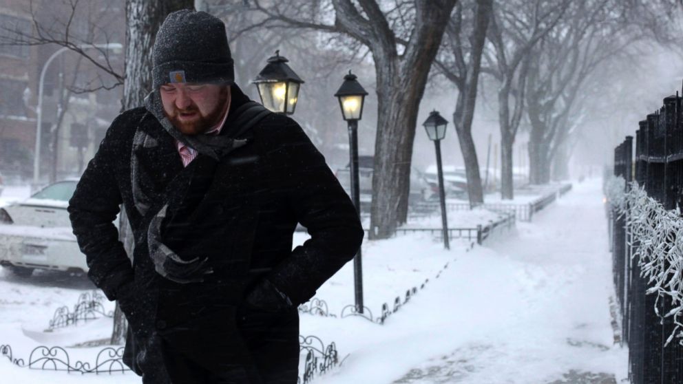 PHOTO: A morning commuter walks against blowing snow, Jan. 2, 2014, in Chicago.